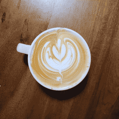 A dithered photo of a latte with some latte art
